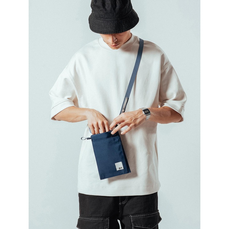 DailyObjects Colourblocked Structured Handheld Bag with Tasselled